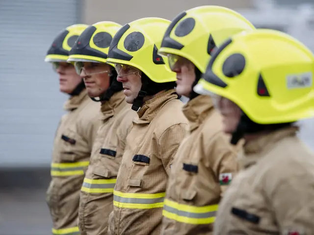firefighters standing in a row